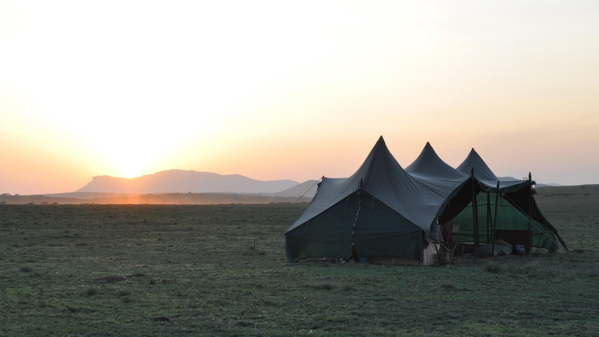 Mobile tented camp mess on the Serengeti plains at sunset